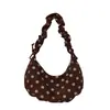 Bolso de hombro único de lunares elegante de nicho para mujer 2026 nuevo bolso cruzado con correa plisada moderno versátil