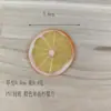 Rodajas de fruta de simulación de fábrica rodajas de limón de plástico rodajas de limón de PVC rodajas de manzana rodajas de sandía de plástico ventana Fotografía