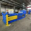 Prensa hidráulica pequeña horizontal tipo 120 para comprimir y enfardar cajas de cartón de desecho, botellas de bebidas y latas de aluminio, así como bolsas tejidas