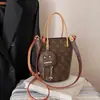 Bolsas femininas transfronteiriças novo modelo 2026, bolsa de mão estampada de alta qualidade, versátil e estilosa, bolsa de ombro e transversal elegante para mulheres