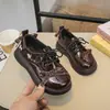 Zapatos de piel para niños 2026 primavera y otoño zapatos de princesa con lazo para niñas zapatos infantiles de estilo británico con suela blanda zapatos de piel de moda