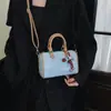 Bolsas de mujer de nicho de lujo ligero 2026 nuevo súper popular bolso tote de mezclilla bolso Boston tipo almohada bolso de hombro cruzado