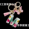 Suministros del Fabricante Llaveros con Flores Secas Prensadas 26 Letras del Alfabeto Inglés Llaveros con Borla de Mariposa Charms para Bolsos de Mujer