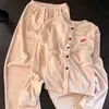 Nueva colección de otoño e invierno para mujer: Conjunto de pijama de forro polar acanalado con cuello redondo, lindo y cálido, estilo coreano, popular en línea, conjunto de dos piezas para estar en casa