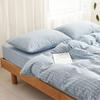 Algodón teñido en hilo de algodón lavado seersucker cuatro piezas algodón puro sábanas a rayas color sólido ropa de cama para casa de huéspedes