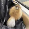 Fabricantes de colgantes de bola de pelo de zorro colgante de cola de zorro de pelo liso todo tipo de colgante de felpa paloma de felpa