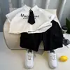 Ropa de Verano para Niños 2026 Estilo Nuevo Estilo Universitario Traje de Manga Corta para Niños Camisa Delgada de Verano para Bebé Conjunto de Dos Piezas