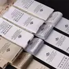 Etiqueta de cuello suave y amigable con la piel, etiqueta impresa, etiqueta tejida, etiqueta de talla universal, etiqueta con logo de diseño, etiqueta de cuello con acabado mate, etiqueta tejida