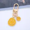 Llavero Creativo de Aleación con Goteo de Aceite Sonriente Corazón de Niña Llavero para Bolso Colgante Protector para Auriculares airpods