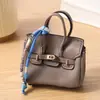 Mini bolso platino, charm para bolso de mujer, accesorio de llavero de coche lindo y creativo, bolsa para auriculares, bolsa para lápiz labial, bolso tipo cubo