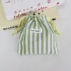 Bolsa de cordón a rayas estilo macarrón minimalista coreano, suave y amigable con la piel, bolsa de almacenamiento portátil para viajes, audífonos, monedas y maquillaje