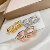 Puños de Oreja de Serpiente Completamente Diamantados de Plata Pura S925 Chapados en Rodio Aretes de Hueso de Serpiente Aretes de Botón Circulares Sin Logo