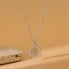 Popular collar con colgante redondo hueco del árbol de la vida estilo europeo y americano para mujer, cadena de clavícula geométrica de acero inoxidable con circonita