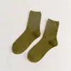 Meias novas femininas cor sólida algodão penteado japonês quatro estações meias cano alto preto e branco JK cor doce meias femininas simples atacado