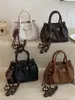 Bolso de mano tejido de estilo coreano de alta moda para mujer, otoño temprano 2026, bolso tote pequeño, bolso de hombro tipo cubo elegante y simple
