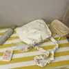 Bolsa de ombro doce e fofa em formato de laço amarelo leitoso, com design de alça de ombro franzida, uma bolsa transversal fofa para meninas