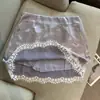 Foto Real do Novo Estilo Primavera/Verão Puro e Sedutor Estilo Pequena Mulher Saia de Renda com Tecido Liso e Barra com Acabamento em Renda para Mulheres