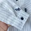 Ropa infantil para niños colección otoño 2026, camisa a rayas de manga larga con bordado de dibujos animados para niños, camisa estilo coreano venta al por mayor y dropshipping