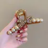 Elegante pinza de garra floral para peinado semi-recogido, nuevo modelo 2026 para mujer, pinza de tiburón de tamaño mediano para la parte trasera de la cabeza, accesorio para el cabello