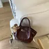 Moda de Invierno 2025 de Tendencia Transfronteriza Bolso de Mano Simple de Gama Alta Tipo Cubo para Mujer Bolso Versátil de Hombro Cruzado