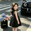 Nuevo Vestido de Verano 2026 para Niñas, Estilo Hepburn Negro de Lunares sin Mangas tipo Camiseta, Vestido de Princesa, Venta al por Mayor desde Fabricante