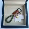Dinero en el Caballo Cuero de Vaca Creativo Exquisito Casual Regalo de Pareja Bolso Lindo Colgante Llavero de Coche Llavero