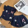 Conjunto de Dibujos Animados para Bebé Niña 2026 Nuevo Estilo Verano Moda Blusa con Mangas Volantes y Shorts Florales Conjunto de Dos Piezas Tendencia