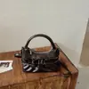 Bolso de hombro y cruzado de moda coreana transfronterizo con pliegues en la axila para mujer, nicho, simple, de alta gama, con lazo, para ir al trabajo