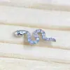 Pendiente de aleación de titanio F136 con forma de serpiente y circón G23 titanio rosca interna circón labio clavo lengua clavo cabeza de joyería perforada