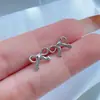 Brincos pequenos e requintados de laço femininos nicho brincos de estrela doces para o dia a dia com acessórios minimalistas atacado