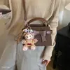 Bolso cuadrado pequeño de moda 2026 bolso cruzado retro de nicho bolso de hombro versátil y elegante para ir al trabajo nuevo estilo