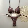 Bikini de lunares blancos de dos piezas para mujer, nuevo estilo verano 2026, cuello halter con lazo, copa triangular, traje de baño sexy reductor