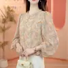 Producto estrella de dropshipping para transmisión en vivo 2026 verano, camisa de mujer estilo coreano con estampado de encaje, holgada y adelgazante, top de manga tres cuartos