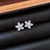 Pendientes de borla con flor de trébol de circonita vintage con un toque de alta gama, pendientes versátiles y de moda al por mayor
