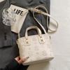 Bolso bandolera ligero y elegante de lujo para mujer, de alta gama, con relieve, estilo cubo portátil, 2025