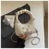 Bolso plisado de diseño único y de nicho para mujer, nuevo estilo 2026, bolso cruzado versátil, bolso tote pequeño súper popular, bolso croissant