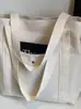 Bolso de lona de gran capacidad para el trabajo y las salidas, bolso de tela de un solo hombro para libros de arte y estudiantes, ideal para desplazamientos diarios y viajes.