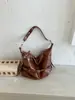Bolsa tote de tendência de moda transfronteiriça bolsa feminina nova retro grande capacidade para trabalho e deslocamento bolsa de ombro única bolsa transversal de textura casual