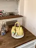 Bolso de Mano de Diseño de Moda de Nicho para Mujer 2026 Nuevo Estilo Coreano Bolso Cubo para Viajes Diarios Bolso de Hombro Único Cruzado Transfronterizo