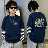 Camiseta de algodón 100% pura para niño, nueva de 2026, ropa infantil, imitación de dos piezas, manga larga, rayas, retazos, para primavera y otoño