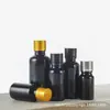 Botella de vidrio negro al por mayor para aceite esencial, frasco gotero oscuro para aceite medicinal, frasco pequeño vacío, botella de mezcla de solución madre de esencia, frasco sellado