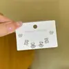 Aguja de plata S925 micro incrustada amor piedra ojo de gato tres pares de aretes coreanos de temperamento moda combinables