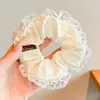 Goma para el pelo con estampado de leopardo marrón para otoño e invierno para mujer, scrunchie elegante y sofisticado para peinados de moño