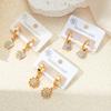 Aretes de acero de titanio de tendencia europea y americana con ojos de luna de flor, multiestilo, personalidad nicho femenina, aretes de acero inoxidable para mujer