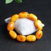 Pulsera de Cera de Abeja Ámbar de Segunda Generación Venta al por Mayor de Fábrica Ámbar Sangre Ámbar Flor Ámbar Medicina Pulsera de Cera Vieja Fluorescente Flotante Agua Salada