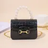 2026 Bolso de Hombro Transfronterizo Directo de Fábrica, Bolso de Mano con Adorno de Perlas, Bolso de Gelatina con Textura de Piedra, Perfecto como Regalo