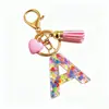 Llavero de Resina Rosa con Lentejuelas y Letras de Alta Venta Transfronteriza, Accesorio Colgante para Bolso con Borla en Forma de Corazón