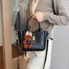 Bolsas Femininas da Moda para Este Ano: Elegante Retrô Textura Simples Versátil Bolsa de Mão Saco de Balde para o Trabalho Nicho Elegante Bolsa Transversal