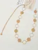 Moda elegante para mujer, estampado hueco dorado estilo abrigo Chanel, cadena metálica para la cintura versátil, al por mayor
