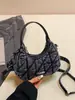 Bolsa Meia-Lua Jeans Acolchoada Única para Mulheres 2026 Nova Tendência Retro Bolsa de Ombro Transversal Bolsa de Mão Fashion Versátil